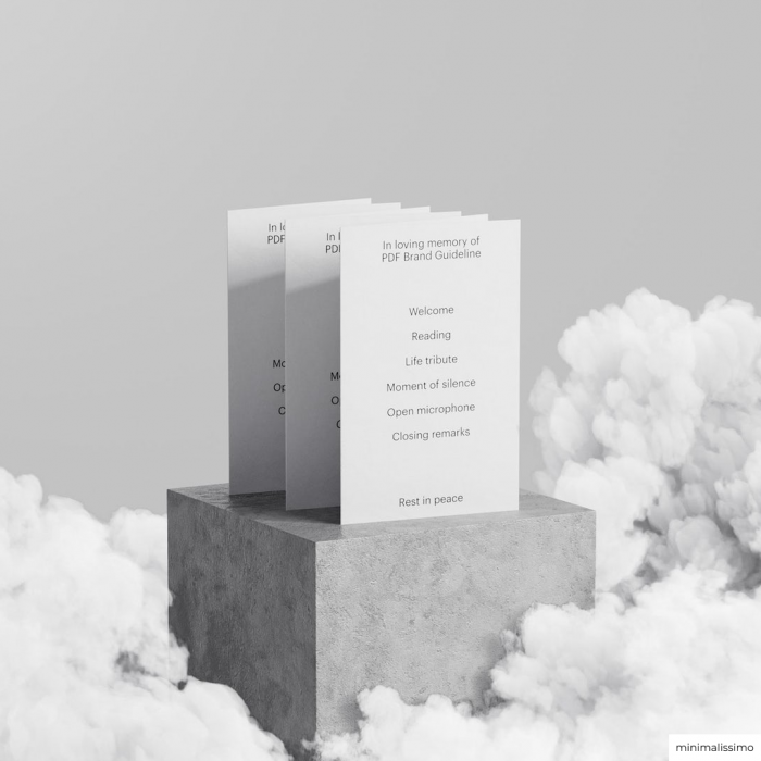 An order of service sitting on top of a box in clouds which reads: In loving memory of PDF Brand Guidelines. 