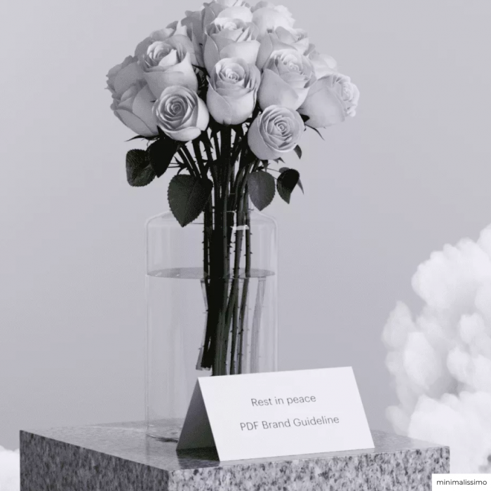 A vase with roses with a piece of paper sitting that reads: Rest in peace PDF Brand Guideline.